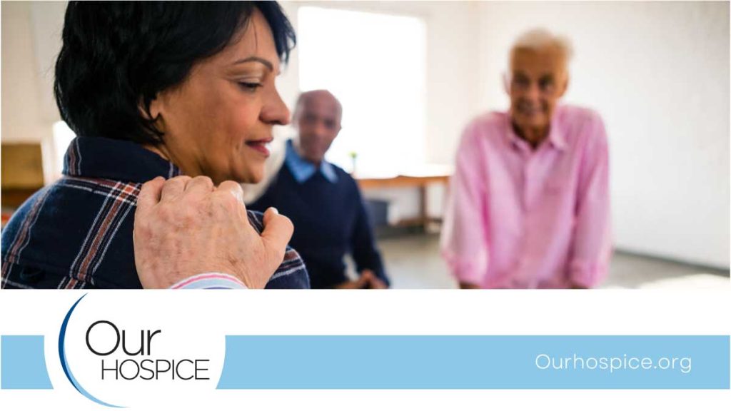 Compassionate hospice caregiver supporting a dementia patient